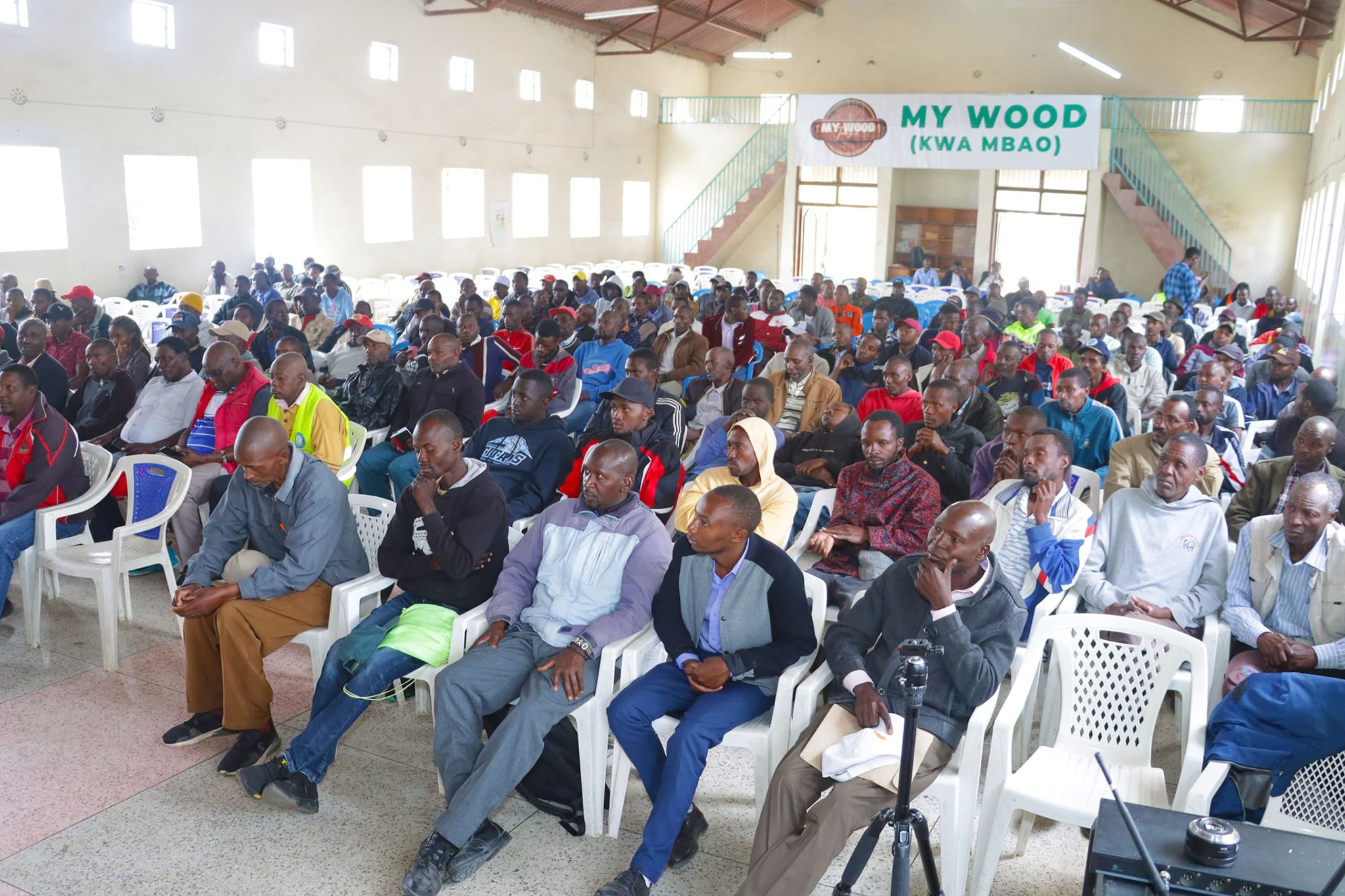 A group of people at a CSR event listening to a speaker